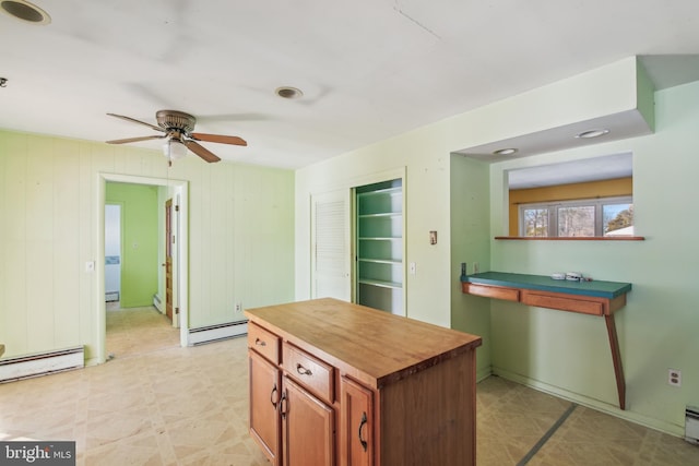 kitchen with butcher block counters, a baseboard radiator, and ceiling fan