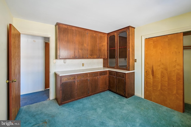 kitchen with light carpet