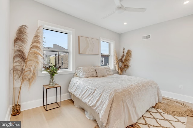 bedroom with ceiling fan and light wood-type flooring