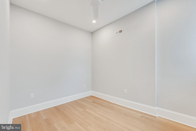 spare room featuring hardwood / wood-style flooring and ceiling fan