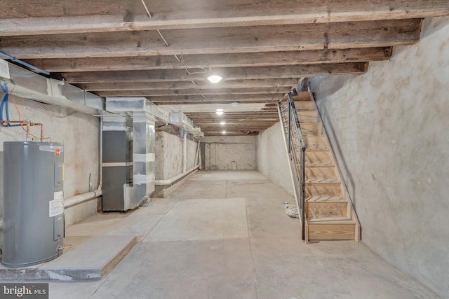 basement featuring water heater and heating unit