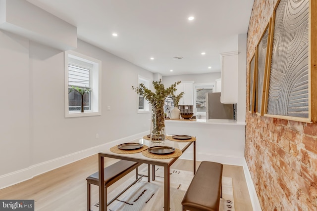 dining space featuring light hardwood / wood-style floors