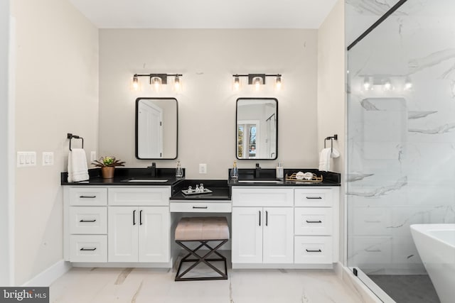 bathroom with vanity and independent shower and bath