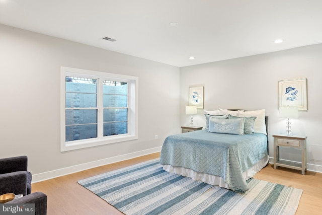 bedroom with light hardwood / wood-style flooring