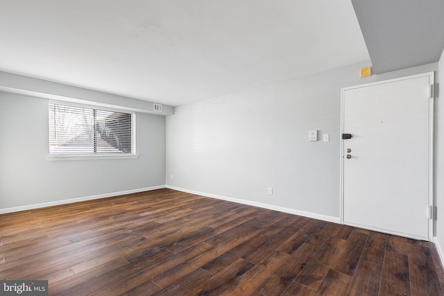 unfurnished room featuring dark hardwood / wood-style floors