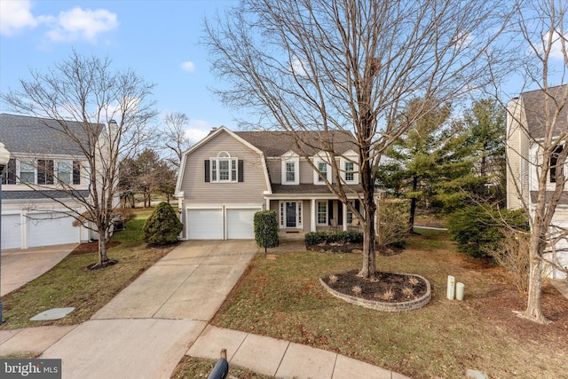 cape cod home featuring a garage and a front yard