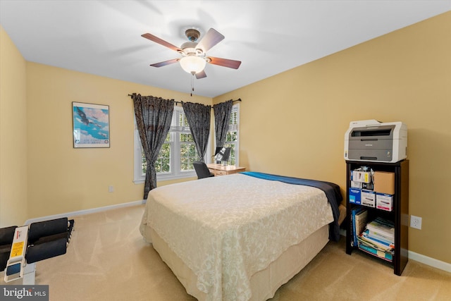 bedroom with light carpet and ceiling fan