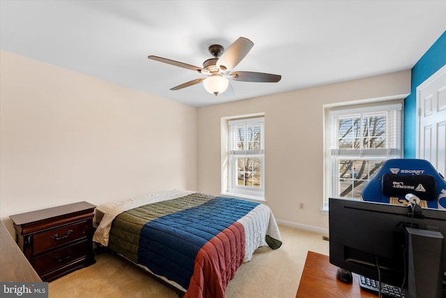 carpeted bedroom with ceiling fan