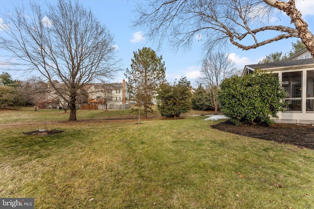 view of yard featuring a sunroom