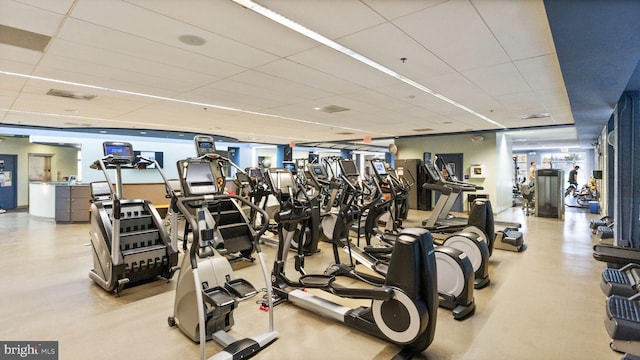 exercise room with a drop ceiling