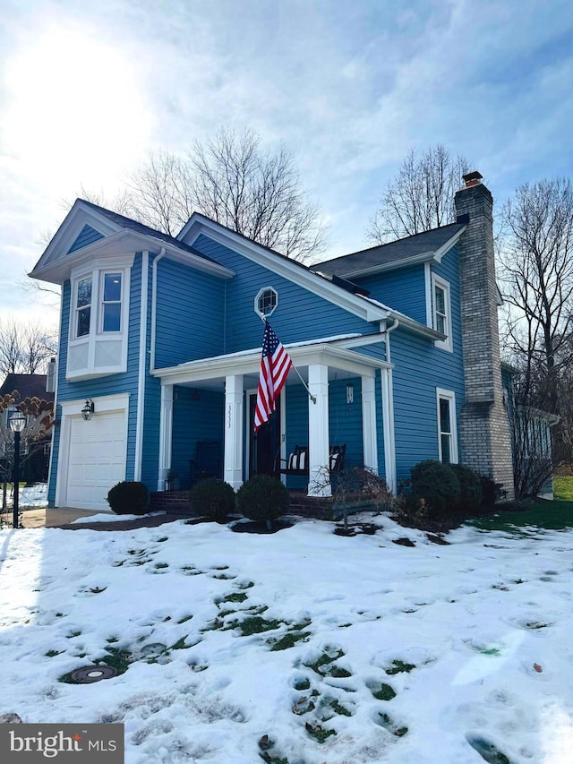 view of front of home with a garage and covered porch