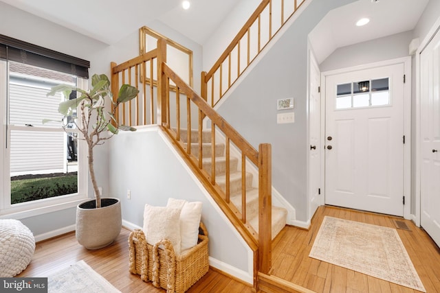 entrance foyer with plenty of natural light and wood-type flooring