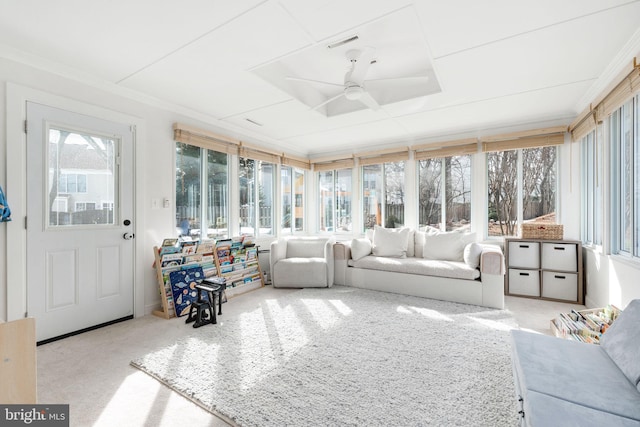 sunroom featuring ceiling fan and a healthy amount of sunlight