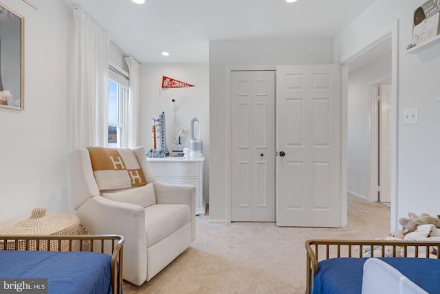 carpeted bedroom with a closet