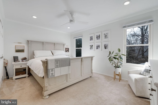 carpeted bedroom with crown molding and ceiling fan