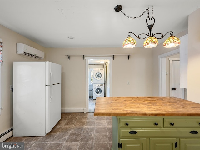 kitchen with stacked washing maching and dryer, white fridge, a wall unit AC, and butcher block countertops