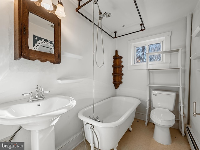 bathroom featuring a baseboard heating unit, sink, a tub, and toilet