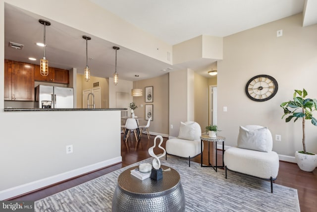 living room with dark hardwood / wood-style flooring