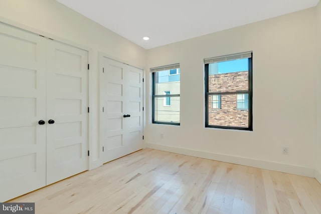 unfurnished bedroom featuring light hardwood / wood-style floors