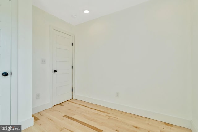 empty room with wood-type flooring