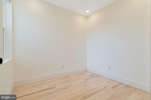 empty room with light hardwood / wood-style floors