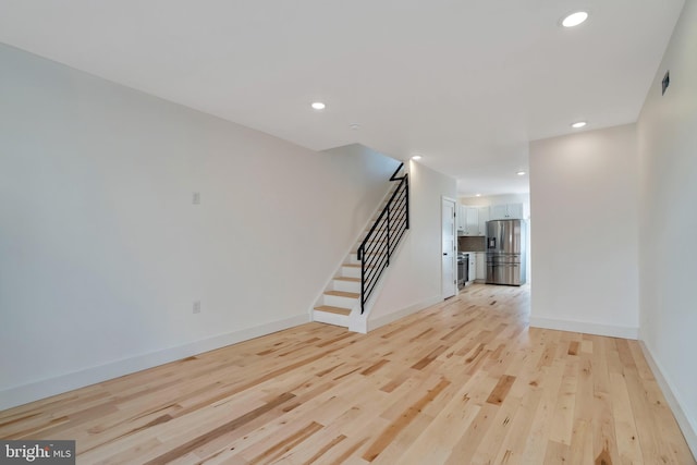 unfurnished living room featuring light wood-type flooring