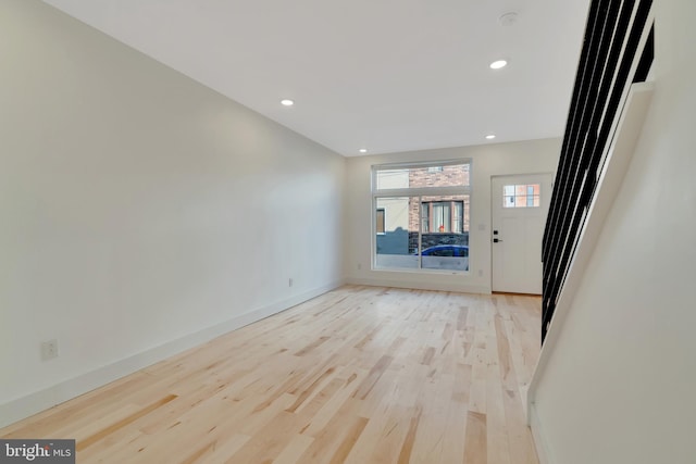 unfurnished living room featuring light hardwood / wood-style flooring