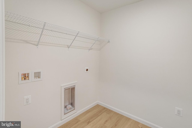 35666 Aspen Way, Locust Grove, VA 22508 - laundry room with hookup for an electric dryer, baseboards, hookup for a washing machine, and light wood-style floors