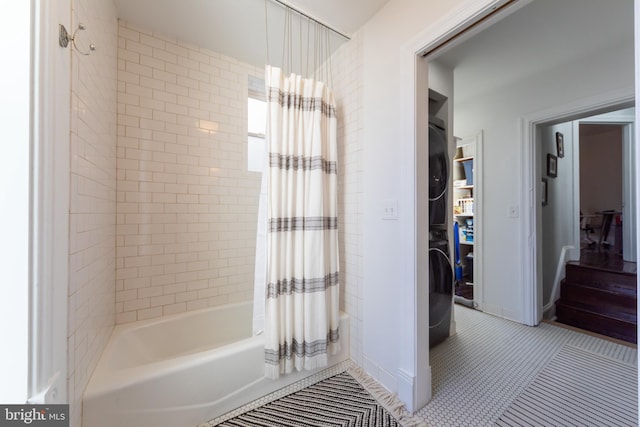 bathroom with tile patterned floors and shower / bath combo