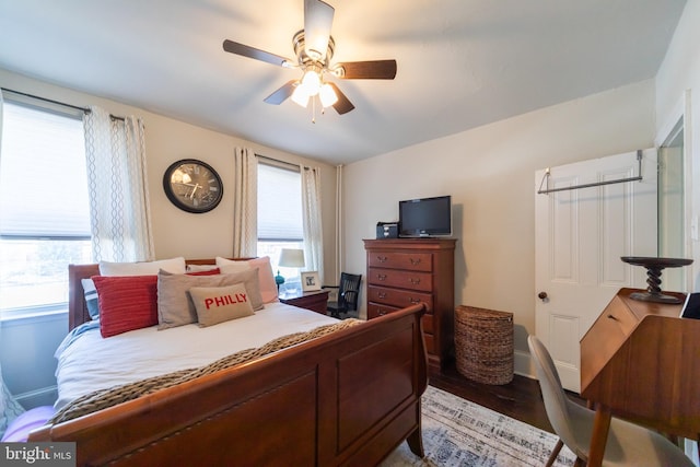 bedroom with hardwood / wood-style floors and ceiling fan