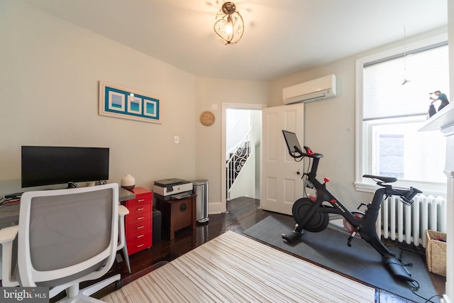 office with an AC wall unit, dark wood-type flooring, and radiator heating unit