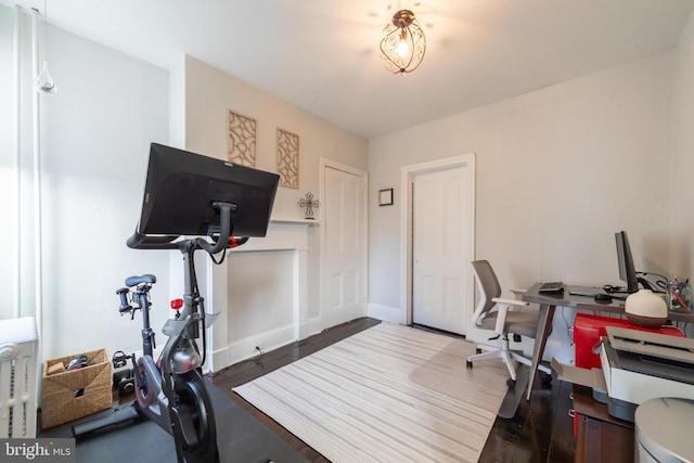 home office with hardwood / wood-style flooring