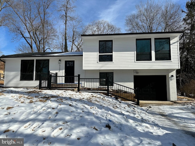 view of front of property with a garage