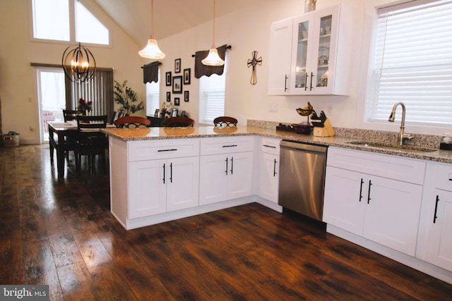 kitchen with pendant lighting, sink, white cabinets, dark hardwood / wood-style flooring, and stainless steel dishwasher