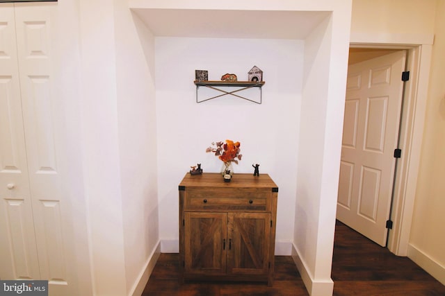 hall with dark hardwood / wood-style floors