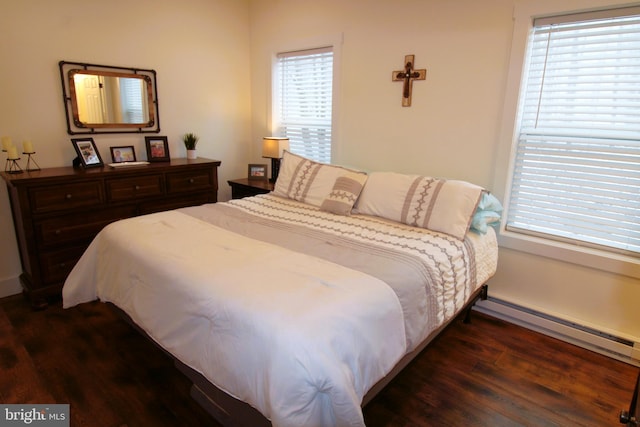 bedroom featuring dark wood-type flooring and baseboard heating