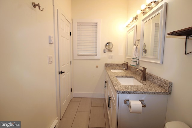 bathroom with tile patterned floors and vanity