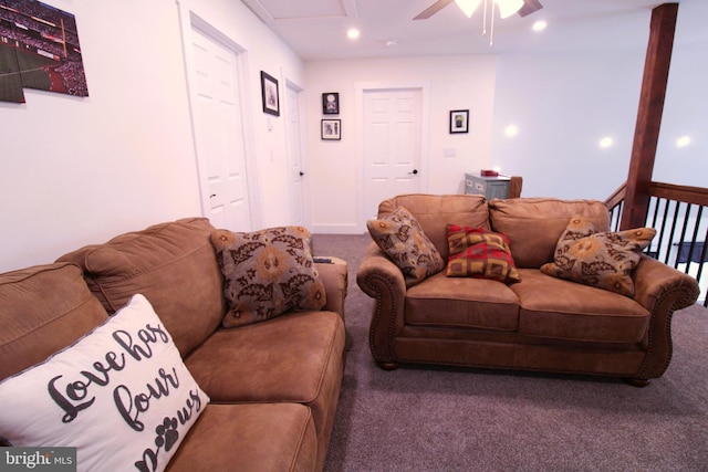 carpeted living room featuring ceiling fan