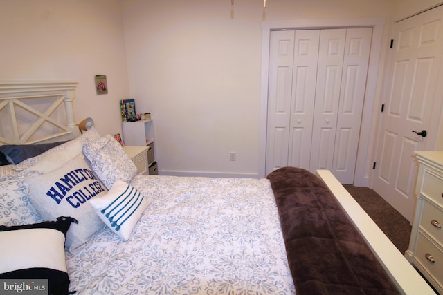 carpeted bedroom featuring a closet