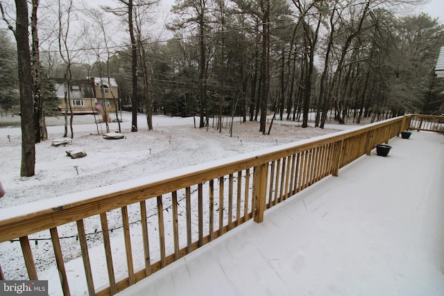 view of snow covered deck