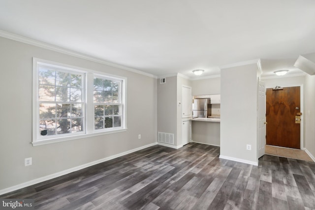 unfurnished living room featuring ornamental molding and dark hardwood / wood-style floors