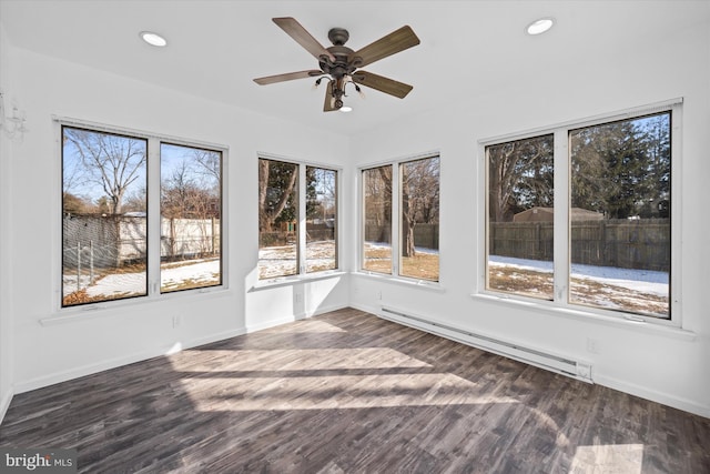 unfurnished sunroom with a baseboard radiator and ceiling fan