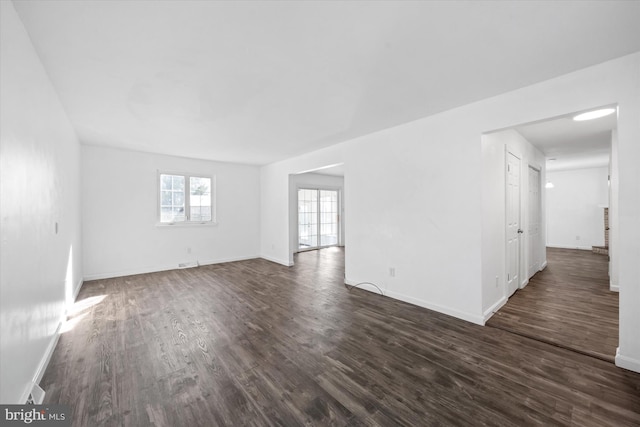 empty room featuring dark hardwood / wood-style flooring