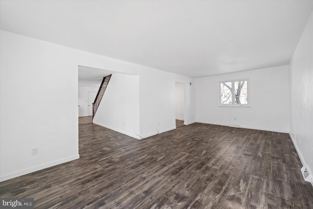 unfurnished room featuring dark hardwood / wood-style flooring