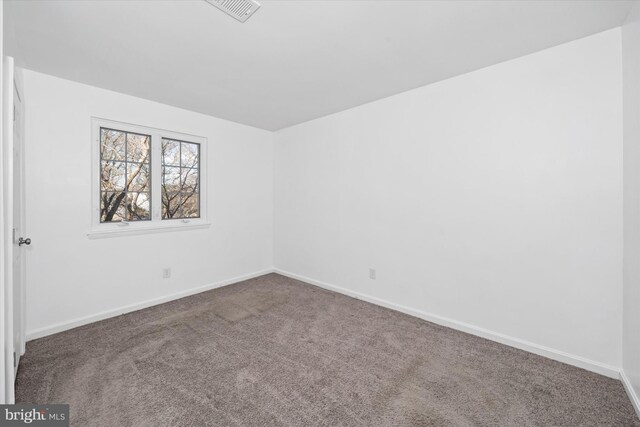 empty room with carpet flooring