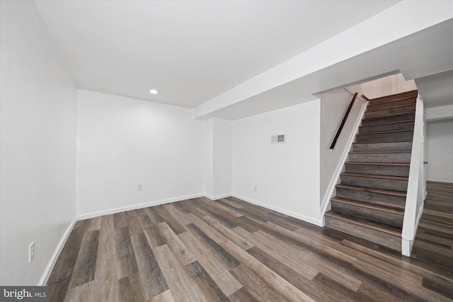 basement featuring dark hardwood / wood-style floors