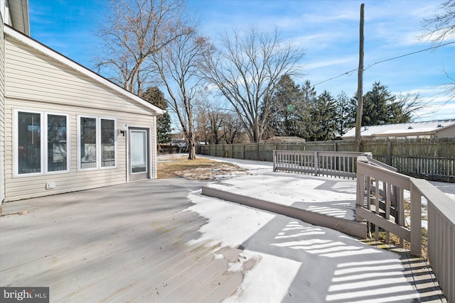 wooden terrace with a patio area