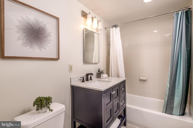 full bathroom featuring vanity, shower / tub combo, and toilet