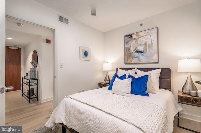 bedroom featuring light hardwood / wood-style floors