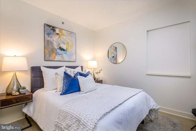 bedroom featuring hardwood / wood-style flooring